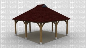 A two bay oak framed gazebo open all sides with gablets on the roof.