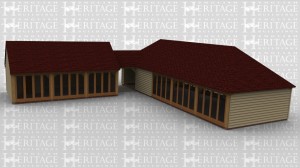 An L shaped oak framed garden room complex. Buildings connect in corner with a open corridor. Both buildings have full height glazing.