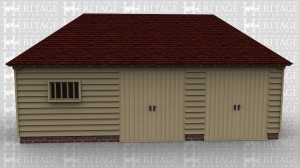 An oak framed out building with both personel and barn doors for ease of access.