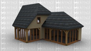 A oak frame home extension with upper floor and a thatched roof. The ground floor has full height glazing on 4 walls and a single window on the back of the extension, the first floor area has one window to allow the natural light into the room