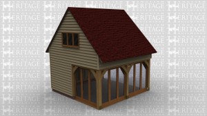 A  oak frame home extension with an upper floor in a sling brace design. This building has full height glazing along two walls and an interior staircase. The staircase leads to the first floor on which there is a 3 pane window allowing plenty of natural light into the room