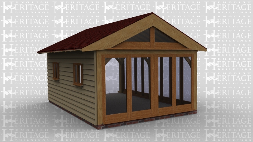 An oak frame home extension with full height glazing on 2 walls and on the thrid wall there are 2 smaller windows.