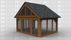 An oak frame garden room home extension with full height glazing on all sides and a glazed gable.