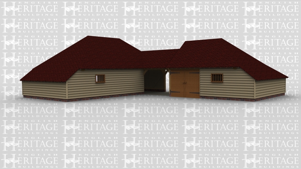 A 6 bay oak frame building made up of 3 frames. The first frame is 3 bays in size boarded at the front with an internal aisle on the left, the front wall has a single mullion window and  at the rear 2 of the bays are left open with the 3rd bay boarded with a mullion window. The second frame is a single bay and is a link between the other 2 frames, it is open at the front and the rear. The final frame accounts for the other 2 bays, there is a pair of iroko garage doors at the front and a mullion window, this frame has an aisle on the left and rear.