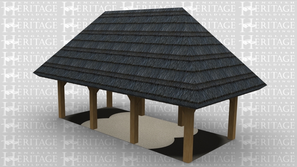 A 3 bay oak framed building with a thatch roof and is open on all sides.
