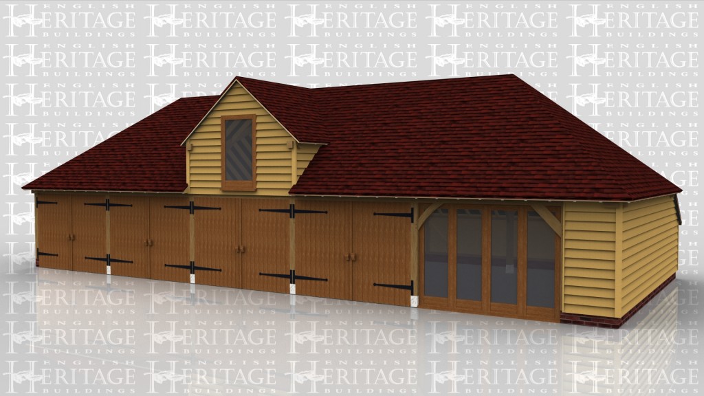 A 5 bay oak frame garage with 4 of the bays enclosed at the front with a pair of iroko garage doors while the fifth bay has a section of full height glazing and the building also has an internal aisle on the right and the rear. On the centre bay there is a barn entrace area containing a large window to allow plenty of natural light into the building.