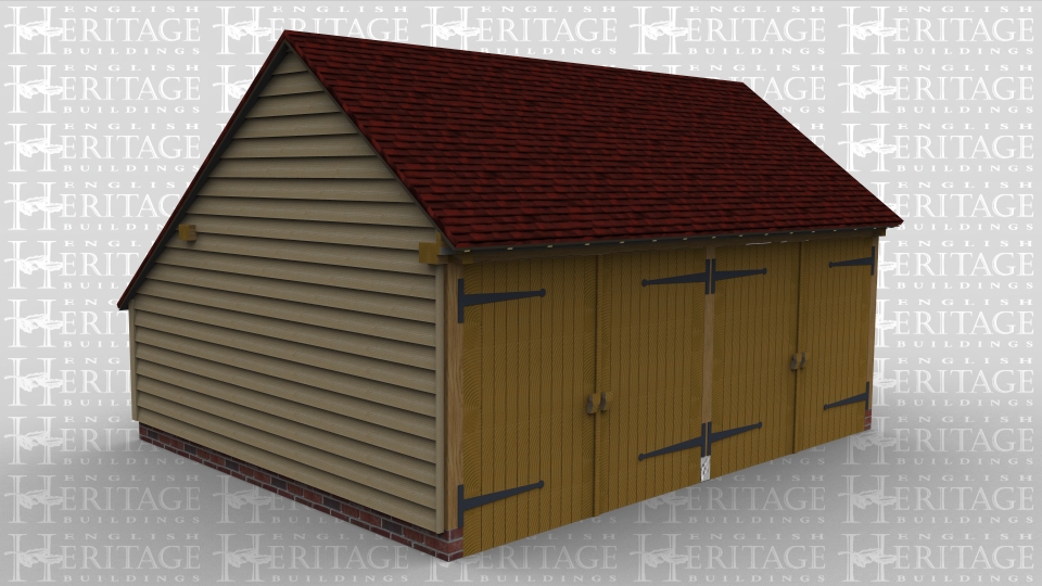 A 2 bay oak framed garage with a pair of iroko garage doors at the front of each bay while on the right wall there is a 2 light window and a solid single door, the left hand bay has an internal aisle at the rear