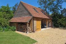3 bay oak frame garage with a room above