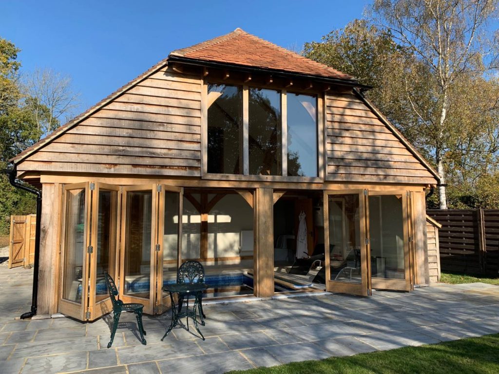 bifold doors and windows in oak building